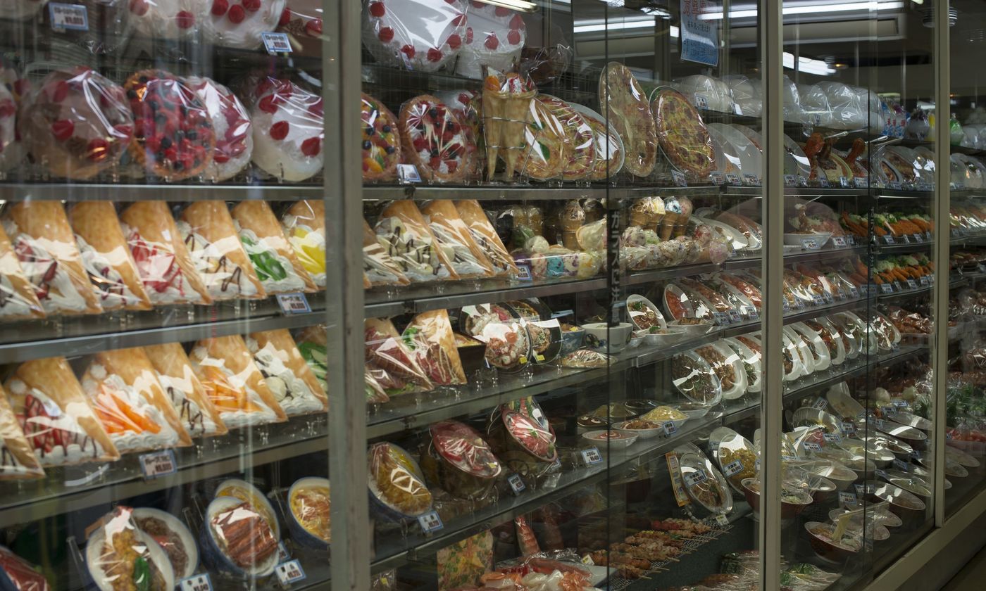Shelves of colourful plastic food samples in a shop window on Kappabashi, Tokyo's restaurant-supply street